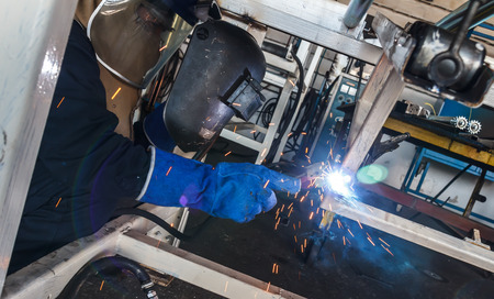 Industrial steel welder in factory