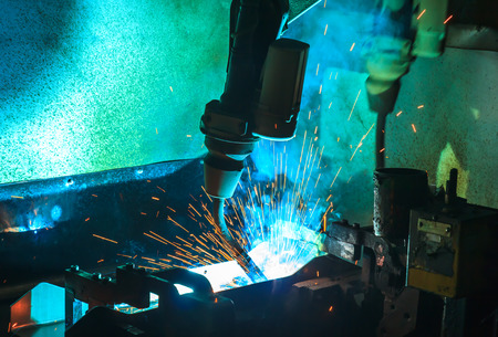 Robots welding  movement in a car production factory
