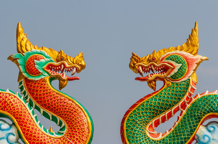 Two golden dragon statuesの写真素材
