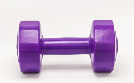 purple dumbbells plastic isolate on white backgroundの写真素材