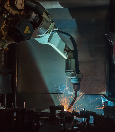 Welding robots movement in a car factoryの写真素材