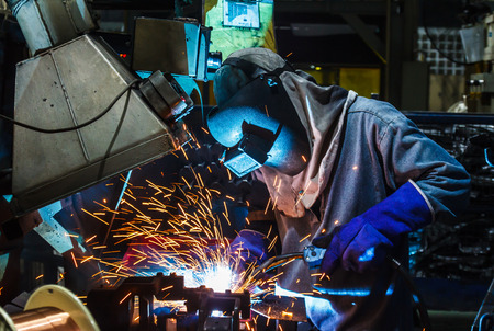welder, welding automotive part in a car factory