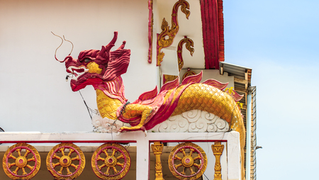 dragon statue on temple roof thai. backgroundの写真素材