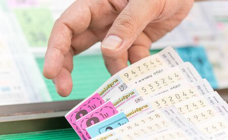 Bangkok,Thailand - September 30, 2019: Customer choosing buy Thai national lottery ticket.
