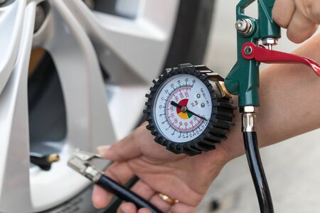 Tools checking air pressure gauge of car tyre.