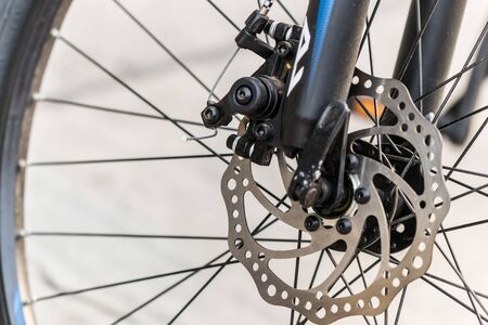 Brake disc of a front bicycle wheel. close up photo