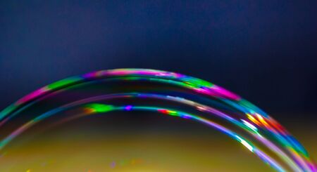 Rainbow colors created by soap, bubble,or oilの写真素材
