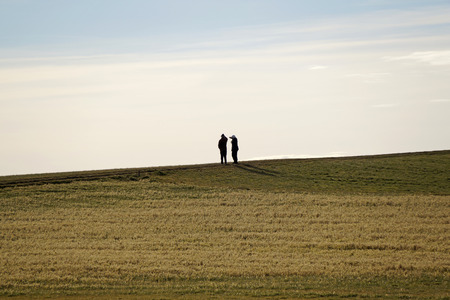 an older couple looking afarの写真素材
