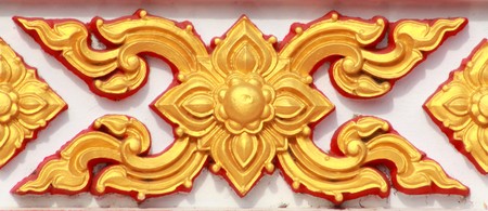 Pattern of Thai style molding art at the wall of temple