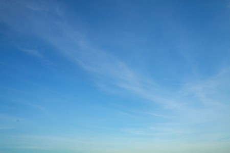 Blue sky with some slight clouds in hot summer.の写真素材