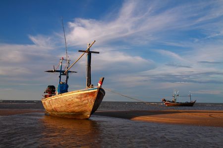 fisherman boat lying on the tropical beach
