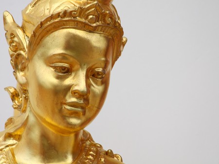 a golden thai angel statue inside temple in Pattaya Thailand. の写真素材