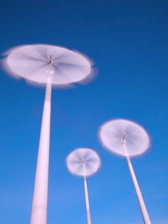 motion blade of modern win turbine in windy day with blue sky.の写真素材