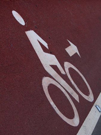 Bicycle lane with white bicycle sign.の写真素材