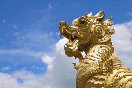 Image of Thai golden Lion Statue with blue sky, north region of Thailand.の写真素材