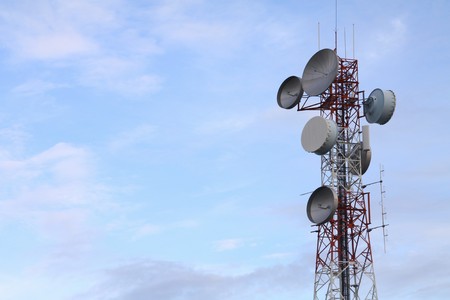 Communication tower over a  blue sky. の写真素材