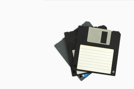 old Floppy disks isolated on white backgroundの写真素材