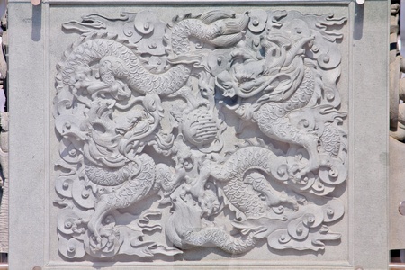 asia dragon stone carved pattern on a wallの写真素材