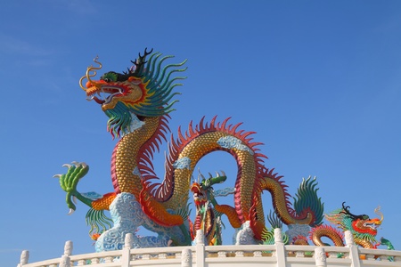 colorful chinese dragon statue with blue sky