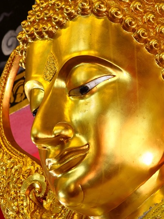 close-up to golden Buddha faceの写真素材