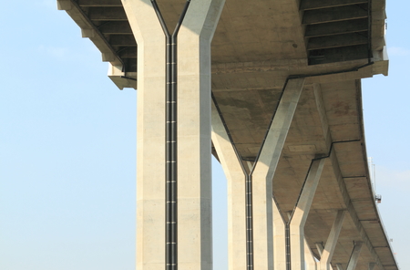 concrete construction pattern under Bhumibol bridge, Bangkok, Thailand on blue sky backgroundの写真素材