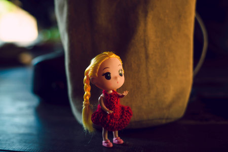 Doll girl red shirt  Light warm toneの写真素材