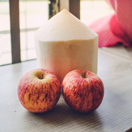 Coconut with apples and wood.の写真素材