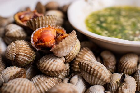Scalding clams are appetizing red with a spicy sauce.の写真素材