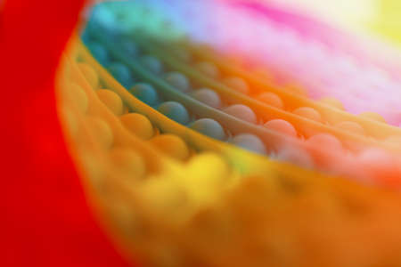 Children's toys with many colors, blurry images, cloudy light, make a background, text.の写真素材