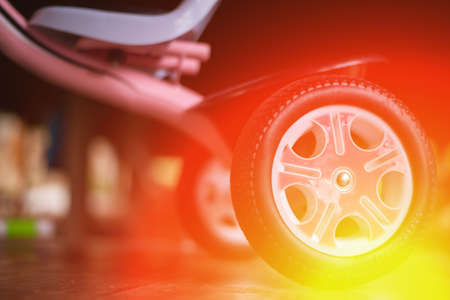 Children's bicycles, toys, vehicles that most of the children play with. There is an orange light on...