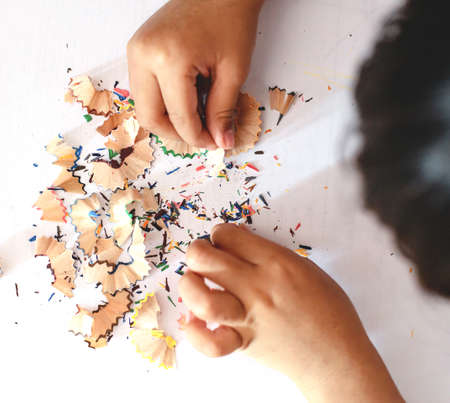 children playing crayons, pencil sharpeners, white background, learning, coloringの写真素材