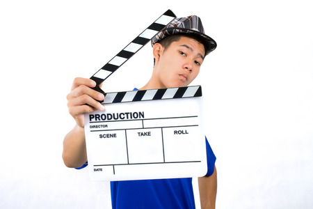 Man with clapboard film slate on a white background.の写真素材