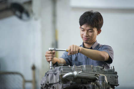 Man are repairing car engine at garage.の写真素材