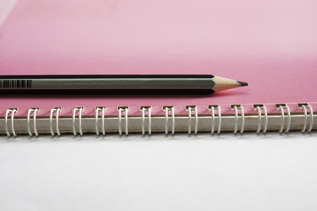 Notebook on the white with pencils.の写真素材