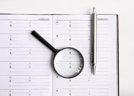 Blank reporters notebook and pencil on a whiteの写真素材