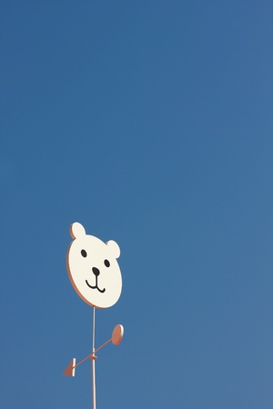 Weather vane - bear on  blue sky. の写真素材