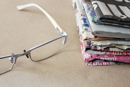 newspaper and glassesの写真素材