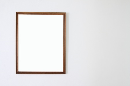 Photo frame on white wallの写真素材