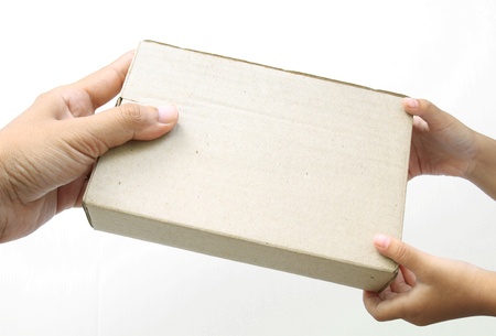 Hand holding a box on white backgroundの写真素材