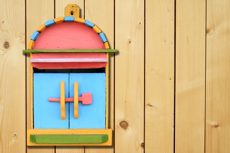 colorful wood mailboxes on wood backgroundの写真素材