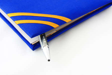 book with pen on whiteの写真素材