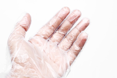 Hand with Plastic gloves on white background の写真素材