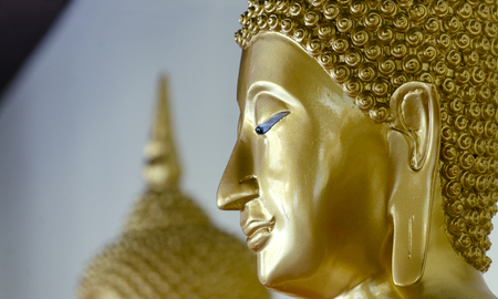 Closeup of Head Buddha statue with golden used as amulets of Buddhism religion at wat sothon templeのeditorial素材
