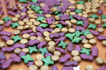 Dry mix Cat and Dog food. fish shape and ball shape background texture