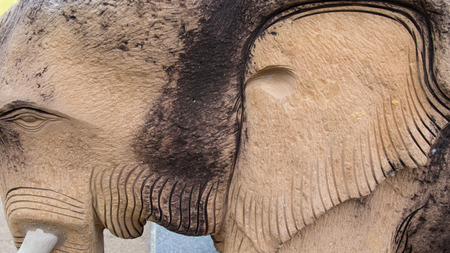 Stone Elephants Standing in front of Temple Stairs