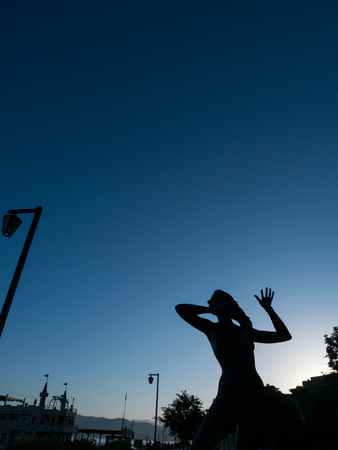 Movement of Woman Statue on The Sidewalk of Toya Lake Parkの写真素材