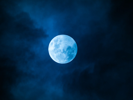 The Full Moon with Cloud in The Blue Night