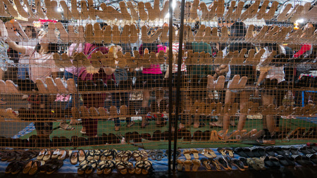 11 March'18 SroewGround Walking Street Buriram Province Thailand : Woman were Choosing to Buy Shoes in The Night Maketのeditorial素材