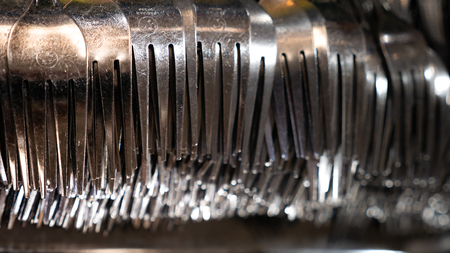The Metal Fork is Lined in Several Hundred on The Trayの写真素材