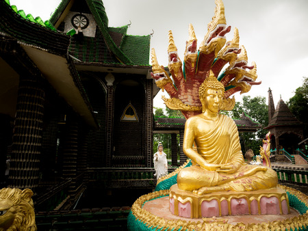 The Sitting Buddha Statue on The Millon Bottles Temple in Unseen Thailandの写真素材